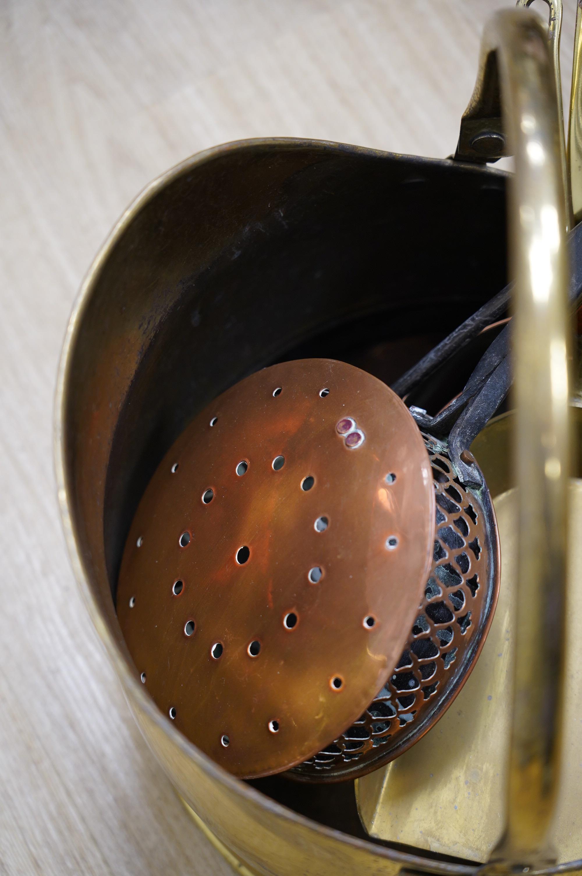 A quantity of copper and brass ware to include coal scuttle and warming pan. Condition - fair to good